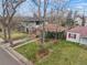 An aerial view of the charming brick home with a landscaped yard at 1665 S Saint Paul St, Denver, CO 80210
