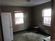 Neutral-toned bedroom enhanced by natural light from two windows, creating a serene atmosphere at 1665 S Saint Paul St, Denver, CO 80210