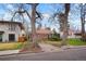 Charming brick home featuring a landscaped front yard and inviting walkway at 1665 S Saint Paul St, Denver, CO 80210
