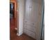 Hallway featuring hardwood floors and a charming built-in storage cabinet with drawers at 1665 S Saint Paul St, Denver, CO 80210