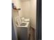 Compact laundry room featuring a standard-size washer and dryer set against a neutral backdrop at 1665 S Saint Paul St, Denver, CO 80210