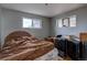 Bedroom with hardwood floors and natural light from the windows at 7747 Quivas St, Denver, CO 80221