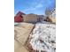 Ranch style home with attached two-car garage and snowy front yard at 4169 S Lewiston St, Aurora, CO 80013