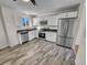 Modern kitchen featuring stainless steel appliances and white shaker cabinets at 4169 S Lewiston St, Aurora, CO 80013