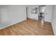 Light-filled living room with hardwood floors and view into kitchen at 4169 S Lewiston St, Aurora, CO 80013