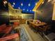 Outdoor living space with comfortable seating and stylish decor with great night-time lighting at 9456 E 51St Dr, Denver, CO 80238