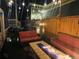 Outdoor patio area featuring a fire pit, comfortable seating, and fence surround with string lights at 9456 E 51St Dr, Denver, CO 80238