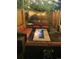 Cozy patio with a fire pit, comfortable seating, and charming string lights for evening relaxation at 9456 E 51St Dr, Denver, CO 80238
