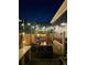 A relaxing outdoor patio area featuring an inviting seating area with a built-in fire pit at 9456 E 51St Dr, Denver, CO 80238