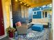 Inviting front porch featuring comfortable seating, stylish decor, and a relaxing atmosphere at 9456 E 51St Dr, Denver, CO 80238