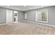 Spacious finished basement with ample natural light and neutral carpet at 3773 S Dayton Way, Aurora, CO 80014