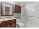 Bathroom featuring a glass enclosed shower, modern vanity, and neutral finishes at 3773 S Dayton Way, Aurora, CO 80014