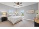 Serene bedroom featuring soft natural light, plush carpeting, and stylish decor at 3773 S Dayton Way, Aurora, CO 80014