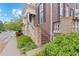 Charming entryway with stone accents, lush greenery, and a welcoming front porch at 3773 S Dayton Way, Aurora, CO 80014