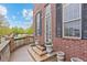 Welcoming entrance showcasing brick accents, steps leading to the front door, and decorative planters at 3773 S Dayton Way, Aurora, CO 80014