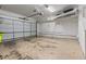 Spacious garage featuring ample storage space, overhead lighting, and a large sectional garage door at 3773 S Dayton Way, Aurora, CO 80014