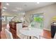 Open concept kitchen and dining area with outdoor access and abundant natural light at 3773 S Dayton Way, Aurora, CO 80014