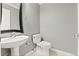 Clean powder room with a pedestal sink and tile flooring at 3773 S Dayton Way, Aurora, CO 80014