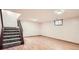 Unfinished basement with stairs and hardwood flooring at 444 Vance St, Lakewood, CO 80226