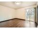 Bright bedroom features sliding glass door and balcony at 444 Vance St, Lakewood, CO 80226