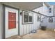 Cozy front porch and entrance with vibrant red door at 444 Vance St, Lakewood, CO 80226