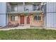 Brick apartments feature private balconies and ground-floor patios for outdoor enjoyment at 444 Vance St, Lakewood, CO 80226