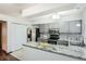 Bright kitchen featuring a breakfast bar and stainless steel appliances at 444 Vance St, Lakewood, CO 80226