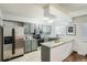 Well-equipped kitchen with stainless steel appliances and eat-in bar top at 444 Vance St, Lakewood, CO 80226