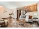 Inviting living room features hardwood floors, neutral paint, and access to a staircase at 444 Vance St, Lakewood, CO 80226