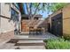 Outdoor dining area on wooden deck next to lawn at 756 Steele St, Denver, CO 80206