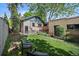 Green backyard featuring seating area with lawn at 756 Steele St, Denver, CO 80206