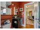 Bathroom featuring a modern vanity, stylish fixtures, and warm-toned walls with decorative art at 756 Steele St, Denver, CO 80206