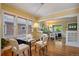 Bright dining area featuring hardwood floors, a glass table, and views of the living room at 756 Steele St, Denver, CO 80206