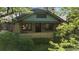 Attractive bungalow with brick accents, showcasing its cozy porch and windows, surrounded by mature landscaping at 756 Steele St, Denver, CO 80206