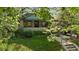 Charming home featuring a well-maintained front yard with lush greenery and a welcoming entrance framed by trees at 756 Steele St, Denver, CO 80206