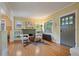 Inviting living room with hardwood floors, a fireplace, built-in shelving, and ample natural light at 756 Steele St, Denver, CO 80206