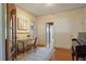 Charming home office featuring hardwood floors, a desk, and a view of the living area at 756 Steele St, Denver, CO 80206