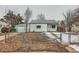 Charming home with a fully fenced yard, garage, and mature trees at 970 Lima St, Aurora, CO 80010