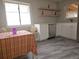 Bright kitchen with natural light, modern stainless steel appliances, open shelving and dining nook at 970 Lima St, Aurora, CO 80010