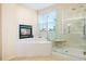 Relax in this bathroom with a soaking tub, shower, and modern fixtures at 395 Winterthur Way, Highlands Ranch, CO 80129