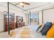 Bedroom with bed, dresser, TV, ceiling fan, and a sunny window at 395 Winterthur Way, Highlands Ranch, CO 80129