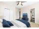 Neutral bedroom featuring double door closets and en-suite bathroom at 395 Winterthur Way, Highlands Ranch, CO 80129