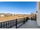 Open deck with black iron railing and a view of an open field at 395 Winterthur Way, Highlands Ranch, CO 80129