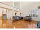 Bright living room with hardwood floors and two-story ceilings at 395 Winterthur Way, Highlands Ranch, CO 80129