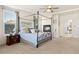 Spacious main bedroom featuring a fireplace, ceiling fan, and ample natural light at 395 Winterthur Way, Highlands Ranch, CO 80129