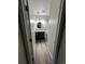 View into remodeled bathroom with stylish vanity, wood-look floors, and modern fixtures at 9762 Appletree Pl, Thornton, CO 80260