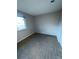 Bedroom with neutral carpet, and natural light from the window at 9762 Appletree Pl, Thornton, CO 80260
