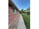 This exterior features a walkway, a green lawn, and brick at 9762 Appletree Pl, Thornton, CO 80260