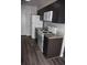 Well-equipped kitchen boasts modern appliances, ample counter space, and sleek cabinetry at 9762 Appletree Pl, Thornton, CO 80260