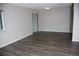 Large and inviting living room with hardwood floors and neutral paint at 9762 Appletree Pl, Thornton, CO 80260